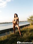 Smoking teen posing naked by the lake - Photo #20