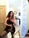 Kinky cutie trying on some black lingerie - Photo #10