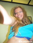 Brunette teacher with glasses shows off her boobs - Photo #1