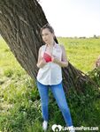 Sexy mom shows off by the tree - Photo #3
