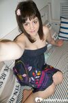 Brunette teen teasing in stockings in the bedroom - Photo #1
