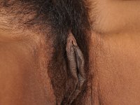 Slender ebony MILF Lippz fingering her fuzzy pussy by the fireplace - Photo #15