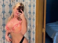 Sultry blonde takes self shots while sporting a strapon cock - Photo #4