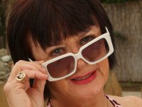 Dark-haired granny Mona strips poolside and shows her hairy holes - Photo #1