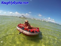 Big titted amateur lounges on an air mattress while naked in a ball cap - Photo #1