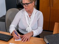 Chubby mature secretary Krizzi toys with her black dildo in her office - Photo #3