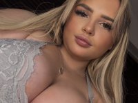 Blonde BBW Minxy Mimi shows her big butt while bent over a kitchen counter - Photo #1