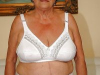 Fatty granny in lingerie gets naked to show her wet cunt - Photo #1
