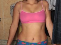 Horny teen with pigtails Roxane exposes her big ass and natural breasts - Photo #1