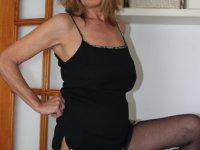 Naked older lady Marta Style shows her saggy tits prior to getting dressed - Photo #13