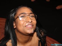 Busty black girl gets on her knees in glasses for bukkake action - Photo #16