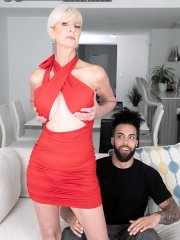 Mature woman with platinum blonde hair Foxxxy Darlin has sex with her toy boy