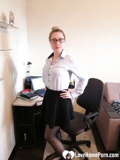 Office worker in black stockings shows her goods
